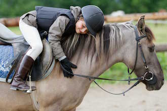 Kinder und Jugendhaus Funk - girl rides a horse