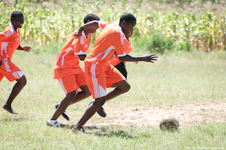 boys play football